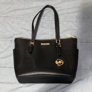 Michael Kors handbag gently used sturdy condition has flat bottom to stand on